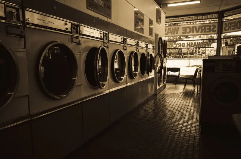 Quarters, Notebooks, and Dynasties: How Five Immigrant Families Turned Laundromats Into Empires
